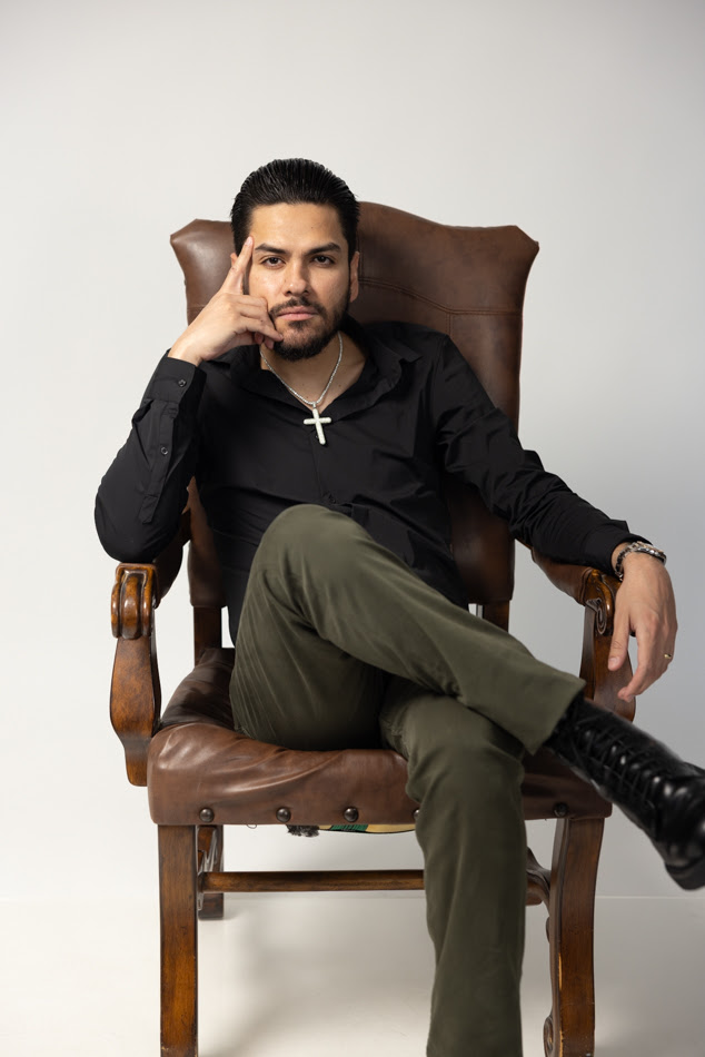"This image captures Virlán García at the launch of his album Mi Entorno, showcasing his pride in his roots and inviting fans to experience the personal stories and sounds reflected in his music."