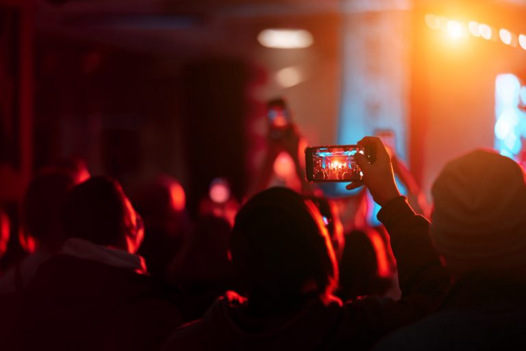 close-up-recording-video-with-smartphone-during-concert