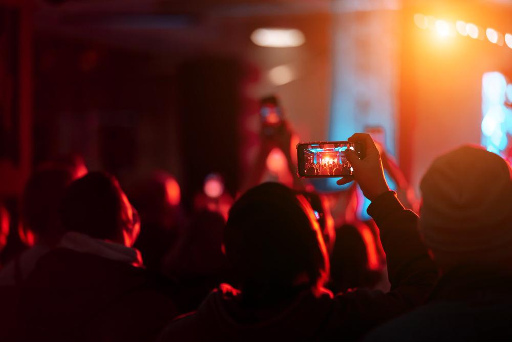 close-up-recording-video-with-smartphone-during-concert